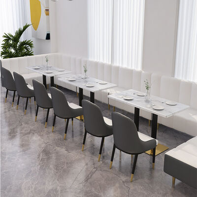 Goede prijs Nordische orangefarbene Retro-Esszimmerstühle Ergonomisches Design Café Restaurant Marmor-Esstisch Moderne Sessel online